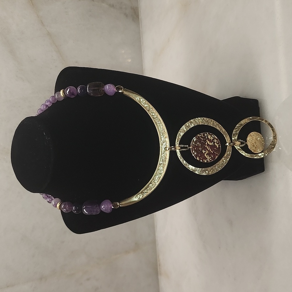 Gold layered medallion necklace with purple stones